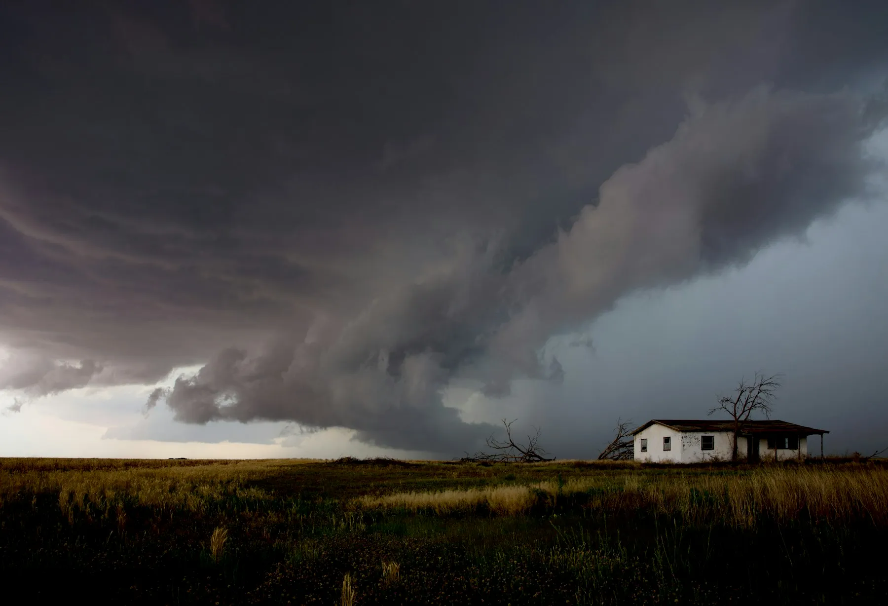 A powerful storm system moving over a Nebraska home at dusk